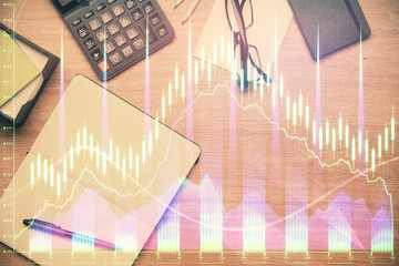 Double exposure of forex graph drawing and work table top veiw. Concept of financial analysis.