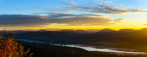 Wall Mural - panorama sunset over mountain and river,pha chanadai cliff,phataem national park,ubon ratchathani,th