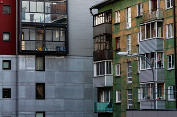 modern and old building standing next to each other