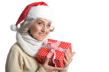 Poster - Portrait of smiling senior woman in Santa hat posing