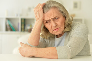 Canvas Print - Close up portrait of sad senior woman