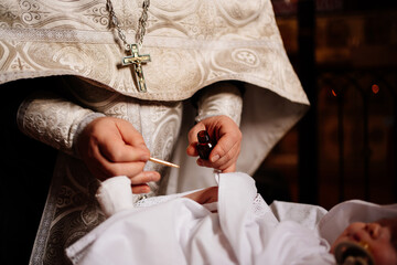 Canvas Print - Confirmation. infant baby at the ritual of baptism in the Orthodox Church.