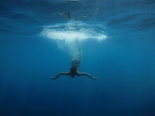 Girl Dives Into The Blue Water