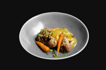 Wall Mural - Chef's Dish meat with vegetables on black background