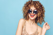 © SHOTPRIME STUDIO - Portrait of a woman smile round sunglasses curly hair fun tshirt