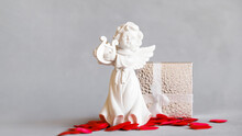 Valentines Day Gift Box, Angel Statue And Little Red Hearts. Valentine Day Concept, Banner 16x9.