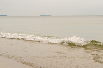 The sea waves hit the beach