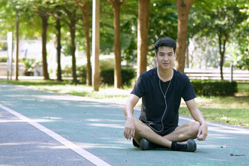 Wall Mural - man sitting and exercising in the park