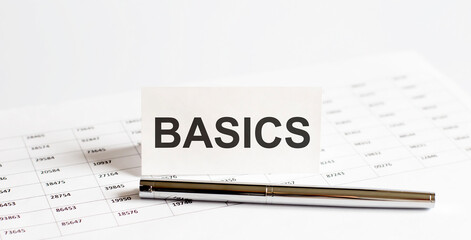 Poster - Text BASICS on stickers,pen on the background of documents. Financial bookkeeping, Accounting Concept.