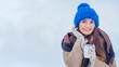 © marina_li_1 - woman in winter hat and a cup in hand