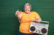 © DisobeyArt - Curvy woman listening music with boombox vintage stereo - Party and confident concept