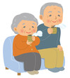 ソファに座って日本茶を飲む高齢者。おじいさんとおばあさん。