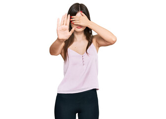 Sticker - Young beautiful caucasian girl wearing casual clothes covering eyes with hands and doing stop gesture with sad and fear expression. embarrassed and negative concept.