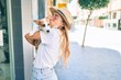 © Krakenimages.com - Young beautiful blonde woman hugging and cuddling puppy dog outdoors