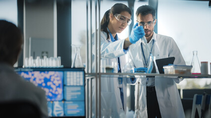 Wall Mural - medical science laboratory with diverse team of research scientists working. microbiologist working 