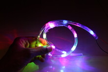 RGB Led Strip Which Is Waterproof Holding In Hand With Glowing Colorful LED Lights