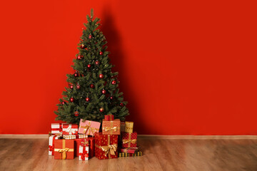 big beautiful christmas tree decorated with beautiful shiny baubles in minimal style and many differ
