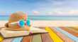 Open book on multicolor wood panel and sea beach background.Summer holiday concept.