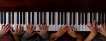 Kids Hands Playing On The Piano, Online Education