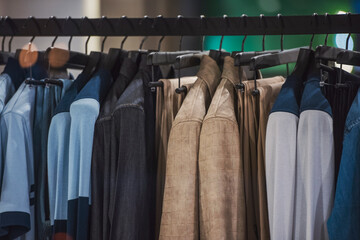 Wall Mural - men clothing on hanger in a shop - shopping in mall concept