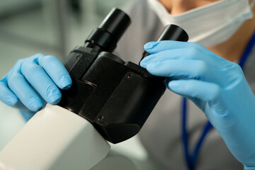 Poster - Gloved hands of worker of scientific laboratory investigating chemical sample