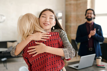 Poster - Happy Asian businesswoman congratulating one of colleagues on great work