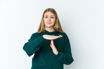 Wall Mural - Young blonde woman isolated on white background showing a timeout gesture.