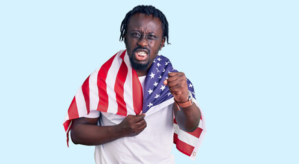 Canvas Print - Young african american man with braids wearing united states flag annoyed and frustrated shouting with anger, yelling crazy with anger and hand raised