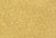 Gold Paper Texture. Smooth Matte Golden Foil Abstract Background. Close-up.