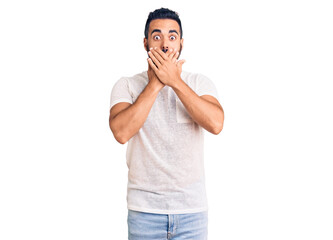 Sticker - Young hispanic man wearing casual clothes shocked covering mouth with hands for mistake. secret concept.