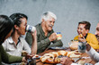 © Marcos - Mexican family eating Rosca de Reyes or Epiphany cake, Roscon de reyes with traditional mexican chocolate cup in Mexico