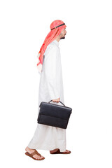 Wall Mural - Arabian businessman carrying a suitcase on studio