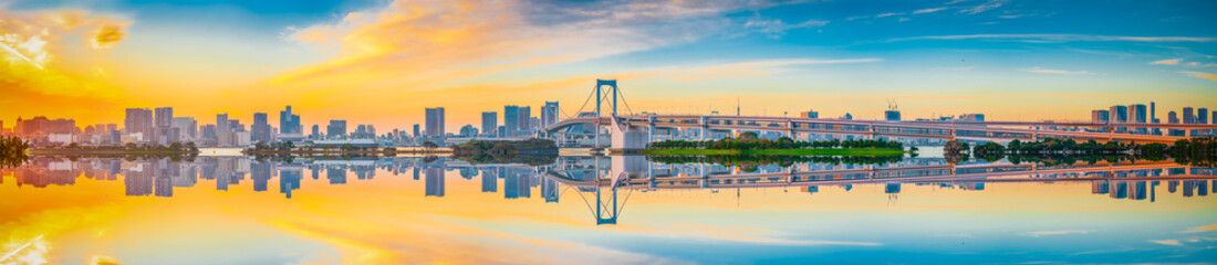 Poster - Sunset panorama view of Tokyo skyline and Rainbow Bridge with reflection