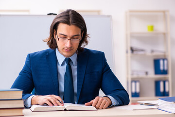 Young businessman student studying at workplace