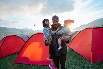 portrait happy of the campground family with beautiful hill views