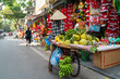 © Hanoi Photography - Fruit vendor on Hanoi old town street at early morning