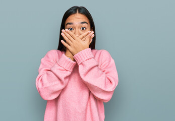 Poster - Young asian woman wearing casual winter sweater shocked covering mouth with hands for mistake. secret concept.