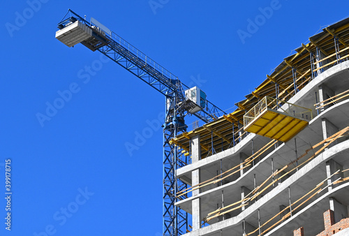 Obraz na plátně Crane and highrise construction site