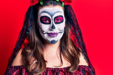 Poster - Young woman wearing day of the dead costume over red with a happy and cool smile on face. lucky person.