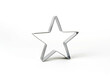 Star shaped metal cookie cutter on a white background.