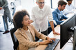 © NDABCREATIVITY - Group of business people working together, brainstorming in office