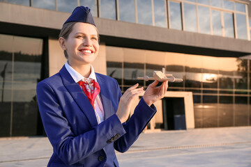 Canvas Print - Portrait of young stewardess outdoors