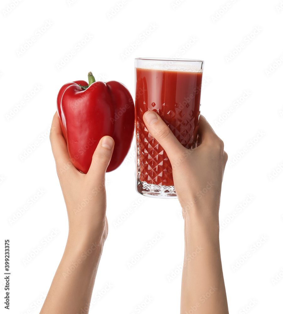Hands with glass of pepper juice on white background