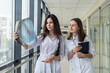 © RomanR - Two female doctors discusses the results of X-ray scan
