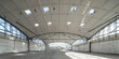 © Aleks Kend - Huge empty industrial warehouse. White interior. Unique architecture. Hemispherical reinforced concrete load bearing roof with windows. Modern building.