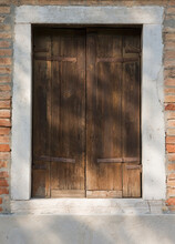 Wooden Door In Brick Building.