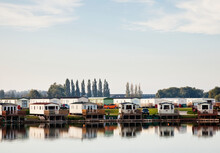Holiday Park Of Static Caravans On Edge Of River Or Lake.