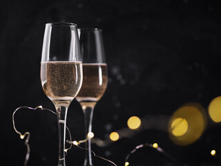 Sticker - Two celebratory glass of champagne on a dark background , bokeh, garland