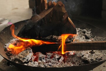 In the cold days it is fun to cook fire,Burning dry wood in large pot