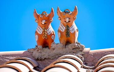 Peru typical traditional house protection on the roof. Two bulls named toritos